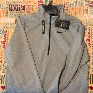 Men’s Nike quarter zip, light gray.
